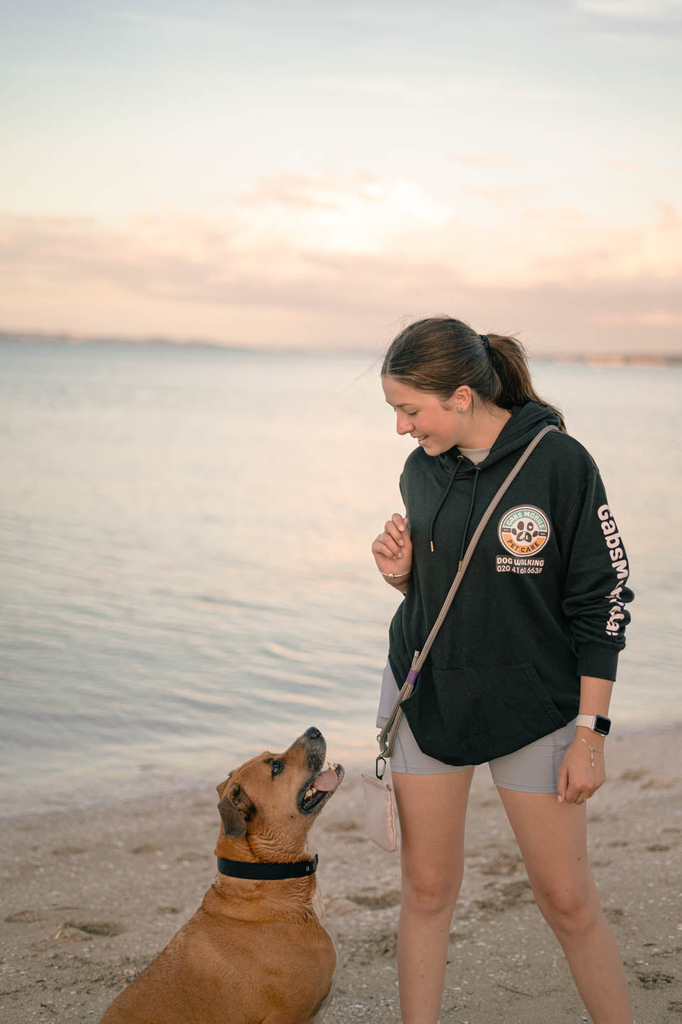 Dog with trainer who is wearing grey Snout & About leash, hands free with safety clasp, handmade from marine rope – Gabs Mobile Pet Care